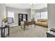 Cozy office space with neutral tones, large desk, and ample natural light at 4198 Haynes Mill Nw Ct, Kennesaw, GA 30144