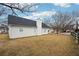 Landscaped backyard with view of houses and a wooden fence at 10 Dairyland Dr, Covington, GA 30016