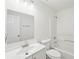 Bright bathroom with a single sink vanity, modern fixtures, and a tub with shower at 10 Dairyland Dr, Covington, GA 30016