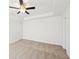 Expansive carpeted bedroom offers a tray ceiling, crown molding, and ceiling fan at 10 Dairyland Dr, Covington, GA 30016