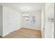 Cozy dining room features modern chandelier lighting, white walls, and wood-look flooring at 10 Dairyland Dr, Covington, GA 30016