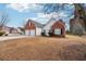 Charming single-Gathering home featuring a brick and siding exterior, two-car garage, and unique silo-inspired architecture at 10 Dairyland Dr, Covington, GA 30016