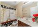 Charming bathroom with a Paris-themed shower curtain, a wood vanity, and decorative accents at 2524 Oakleaf Rdg, Lithonia, GA 30058