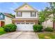 Charming two-story home with brick accents, a white garage door, and well-maintained landscaping at 2524 Oakleaf Rdg, Lithonia, GA 30058