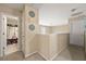 Upstairs hallway with doors leading to bedrooms and bathrooms, decorated with decorative wall art at 2524 Oakleaf Rdg, Lithonia, GA 30058