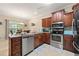 Well-equipped kitchen features stainless steel appliances and ample counter space, next to a dining space at 2524 Oakleaf Rdg, Lithonia, GA 30058