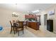 Cozy breakfast nook with dark wood table and chairs, and a view into the functional kitchen at 2524 Oakleaf Rdg, Lithonia, GA 30058