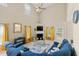 Bright living room with high ceilings, a cozy fireplace, and comfortable blue sectional sofa at 2524 Oakleaf Rdg, Lithonia, GA 30058