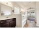 Bathroom features a white marble countertop vanity and soaking tub at 3492 Maple Hill Rd, Lithonia, GA 30038