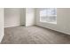 Bedroom with neutral carpet, light-colored walls, and natural light at 3492 Maple Hill Rd, Lithonia, GA 30038