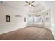 Spacious bedroom with a tray ceiling and multiple windows offering plenty of natural light at 3492 Maple Hill Rd, Lithonia, GA 30038