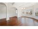 Elegant dining area features hardwood floors, decorative moldings, and a chandelier, perfect for entertaining at 3492 Maple Hill Rd, Lithonia, GA 30038