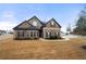 Elegant home featuring a combination of brick and stone facade and professional landscaping at 3492 Maple Hill Rd, Lithonia, GA 30038