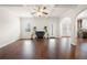 Bright living room features hardwood floors, a fireplace, and multiple windows providing natural light at 3492 Maple Hill Rd, Lithonia, GA 30038