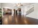 Spacious living area with hardwood floors and open-concept design, seamlessly connecting the kitchen and dining area at 3492 Maple Hill Rd, Lithonia, GA 30038