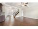 Open-concept living space showcasing hardwood floors, a staircase, and natural light at 3492 Maple Hill Rd, Lithonia, GA 30038