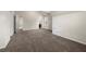 Large room with neutral carpet, plenty of light, and multiple entryways at 3492 Maple Hill Rd, Lithonia, GA 30038