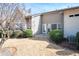 View of the home's exterior showcasing a private backyard area with a patio and established landscaping at 3832 Abbott Ln # 1, Powder Springs, GA 30127