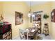 Cozy dining area with bright yellow walls, decorative accents, and natural light at 3832 Abbott Ln # 1, Powder Springs, GA 30127