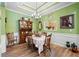 Dining room with decorative chandelier, and an open view into the kitchen through an opening in the wall at 3832 Abbott Ln # 1, Powder Springs, GA 30127