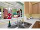 Bright kitchen featuring stainless sink, stylish accessories, and view to adjacent room at 3832 Abbott Ln # 1, Powder Springs, GA 30127