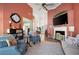Open concept living area featuring a fireplace, lots of natural light, and views of the kitchen at 3832 Abbott Ln # 1, Powder Springs, GA 30127