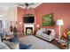 Bright living room features a fireplace, lots of natural light, and a vaulted ceiling with a fan at 3832 Abbott Ln # 1, Powder Springs, GA 30127