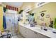 Bright bathroom featuring double sinks, vanities, large mirrors and glass shower at 3832 Abbott Ln # 1, Powder Springs, GA 30127