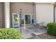 A cozy outdoor patio with seating, a decorative lantern, and view of the manicured yard at 3832 Abbott Ln # 1, Powder Springs, GA 30127