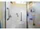 Clean white shower with safety bars, seat, and updated fixtures at 3832 Abbott Ln # 1, Powder Springs, GA 30127