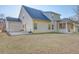 Rear exterior view of home with a large backyard and screened in porch at 4450 Heatherwood Sw Dr, Atlanta, GA 30331