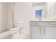 Bathroom with a white vanity, a toilet, a walk-in shower, and gold fixtures at 4450 Heatherwood Sw Dr, Atlanta, GA 30331