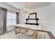 Elegant dining room featuring a modern chandelier and a long table, perfect for Gathering at 4450 Heatherwood Sw Dr, Atlanta, GA 30331