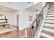 Elegant foyer with a hardwood floor and a staircase with iron railings at 4450 Heatherwood Sw Dr, Atlanta, GA 30331