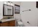 This bathroom features a granite countertop, framed mirror, and convenient towel bar at 4728 Sedum Way, Atlanta, GA 30349