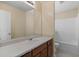 Bathroom featuring a single sink vanity and a shower-tub combination at 4728 Sedum Way, Atlanta, GA 30349