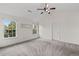 A spacious bedroom featuring vaulted ceiling, carpet, natural light and ceiling fan at 4728 Sedum Way, Atlanta, GA 30349