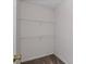 A compact closet space with white wire shelving and neutral colored walls at 4728 Sedum Way, Atlanta, GA 30349