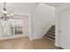 Inviting foyer with hardwood floors, stairs, and natural light from the window, providing a warm welcome at 4728 Sedum Way, Atlanta, GA 30349