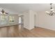 Bright living room featuring hardwood floors, large windows, and an open archway at 4728 Sedum Way, Atlanta, GA 30349
