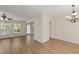 Bright living room with hardwood floors, ceiling fan, neutral walls and natural light from many windows at 4728 Sedum Way, Atlanta, GA 30349