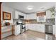 Well-appointed kitchen with stainless steel appliances, granite countertops, and white cabinetry at 2984 Bayard St, East Point, GA 30344