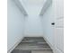 A walk-in closet with shelving and grey wood-look floors at 30 Sportsman Path, Dallas, GA 30157