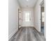 A bright and airy entryway welcomes you with fresh gray vinyl floors and a stylish white front door at 30 Sportsman Path, Dallas, GA 30157