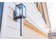 Exterior detail of a black lantern on a white home with wooden shutters on the windows at 30 Sportsman Path, Dallas, GA 30157