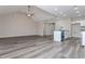 Open concept view of kitchen with island, lots of cabinet space, and living area with vaulted ceilings at 30 Sportsman Path, Dallas, GA 30157