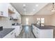 Bright open kitchen with granite counters, stainless steel appliances, and ample cabinet space at 30 Sportsman Path, Dallas, GA 30157