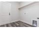 The laundry room has gray floors, a shelf and a laundry hookup at 30 Sportsman Path, Dallas, GA 30157
