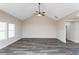 A well lit living room features a vaulted ceiling, gray vinyl flooring, and modern neutral paint at 30 Sportsman Path, Dallas, GA 30157