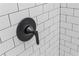 A close up of a matte black shower fixture against white subway tile at 30 Sportsman Path, Dallas, GA 30157